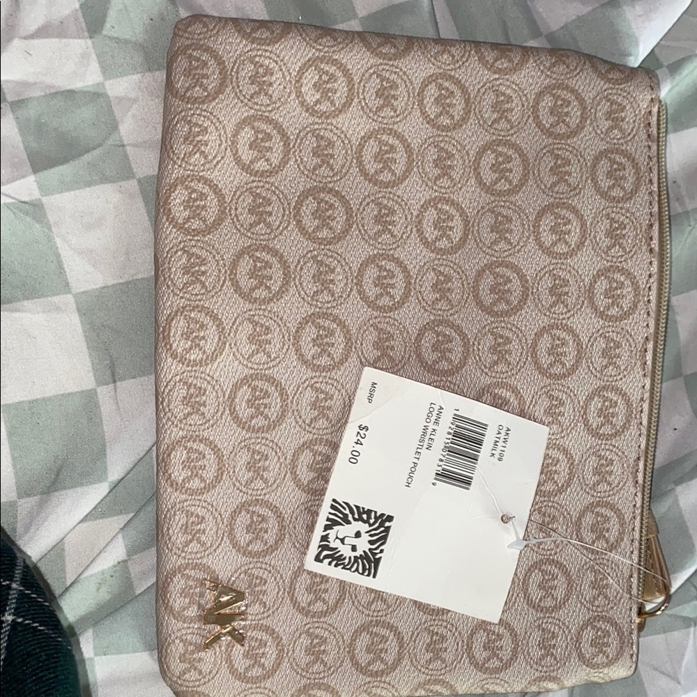 Tan Michael Kors Clutch with Monogram Pattern